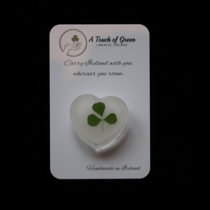 Hand foraged shamrock on a card with black background