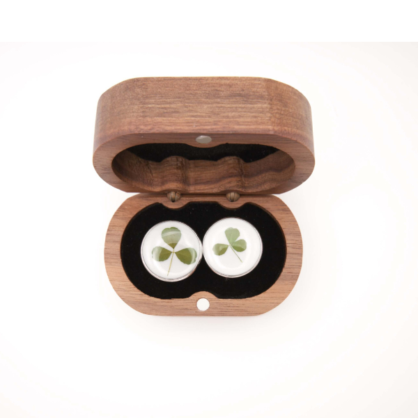 Wooden box with cufflinks featuring hand foraged shamrocks on a white background